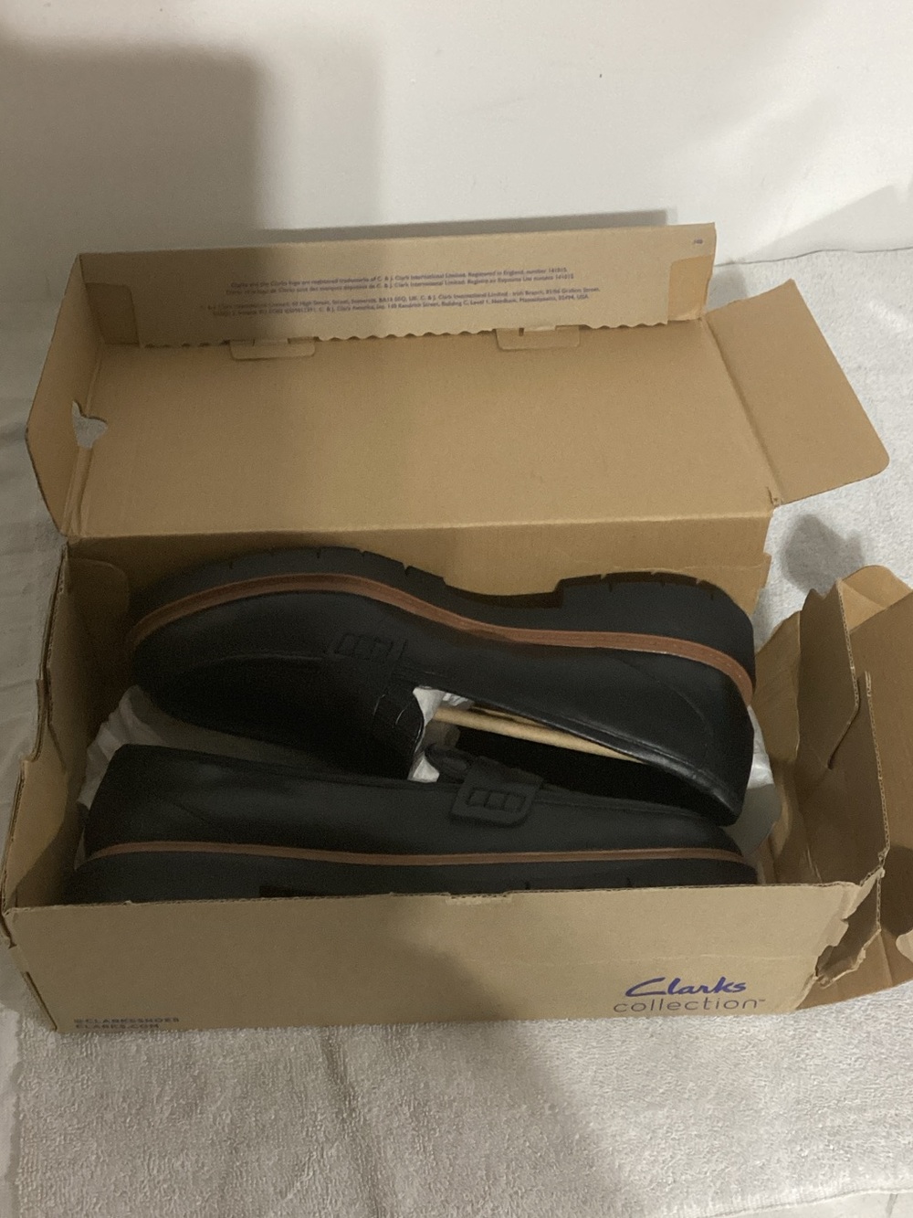 Clarks Black Men’s Slip-On Loafers with Brown Trim